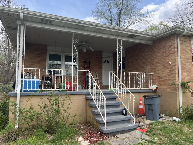 a workspace with furniture and a fireplace