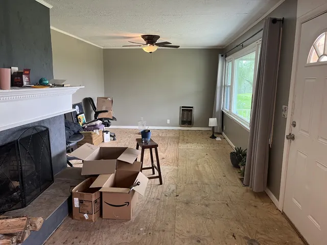 a kitchen with stainless steel appliances a table and chairs