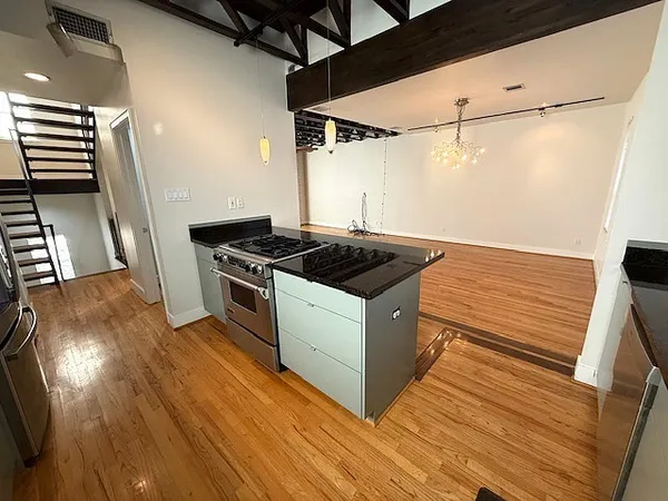 a kitchen that has a sink and a stove