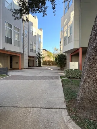 a view of a building with a yard