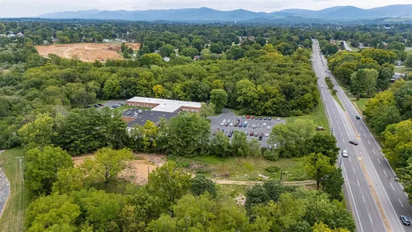 a view of a lake with a yard