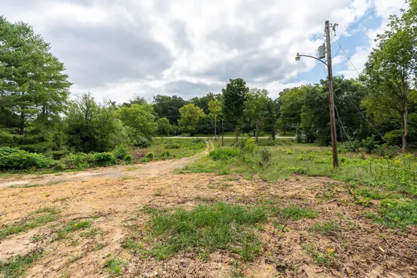 a view of outdoor space with deck and yard