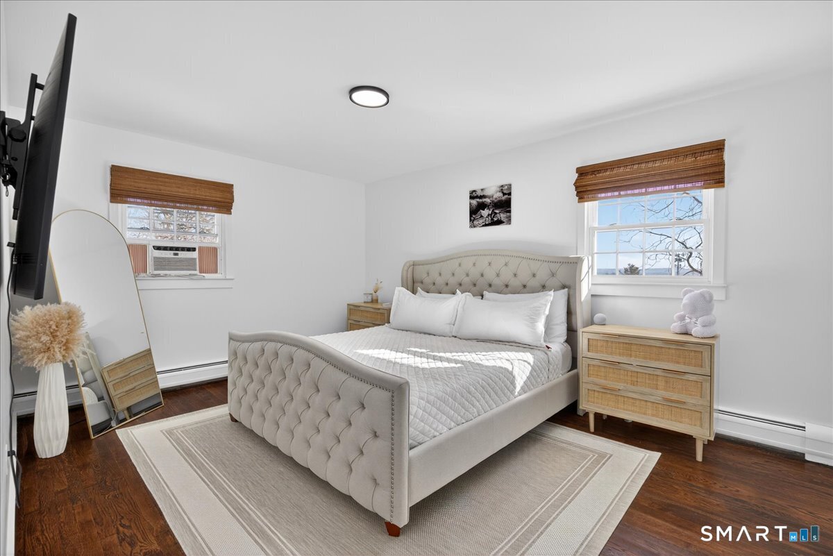 114 Daniel Road Hamden, CT 06517 - Photo 19 of 32 a bedroom with a bed and a night stand
