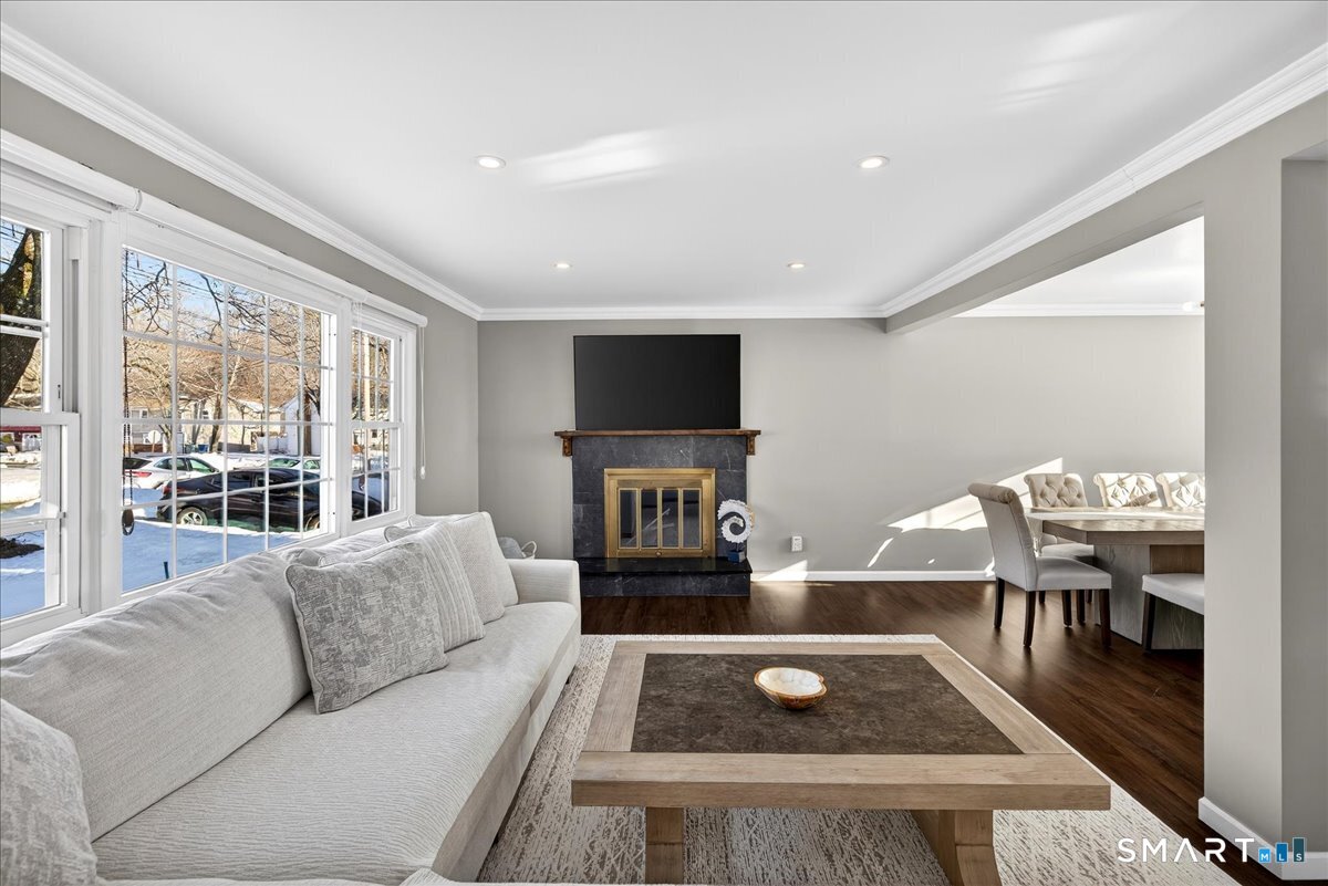 114 Daniel Road Hamden, CT 06517 - Photo 2 of 32 a living room with furniture wooden floor and a flat screen tv