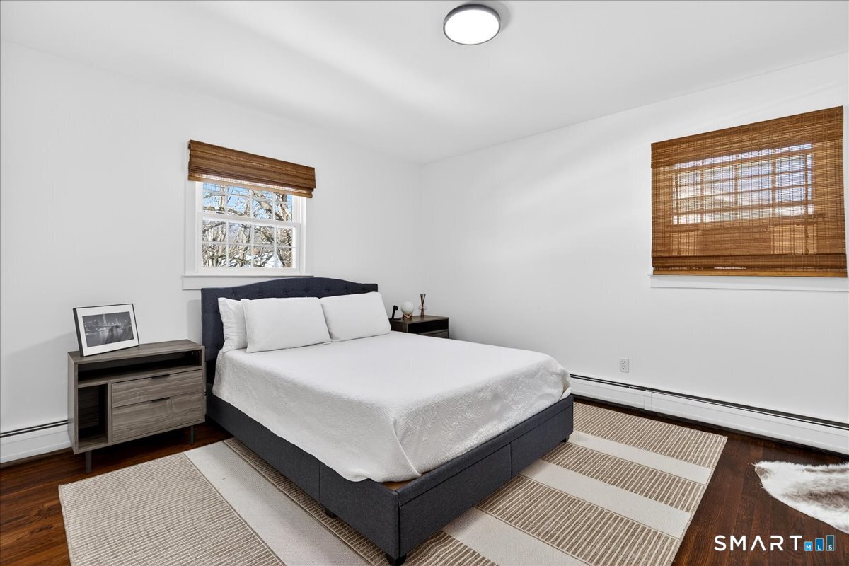 114 Daniel Road Hamden, CT 06517 - Photo 23 of 32 a bedroom with a large bed and a window