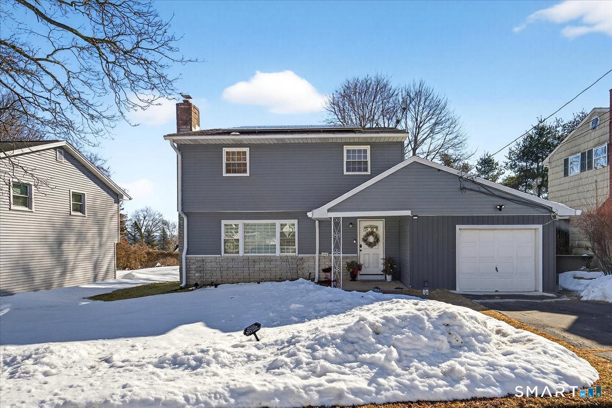 114 Daniel Road Hamden, CT 06517 - Photo 32 of 32 a front view of a house with a yard