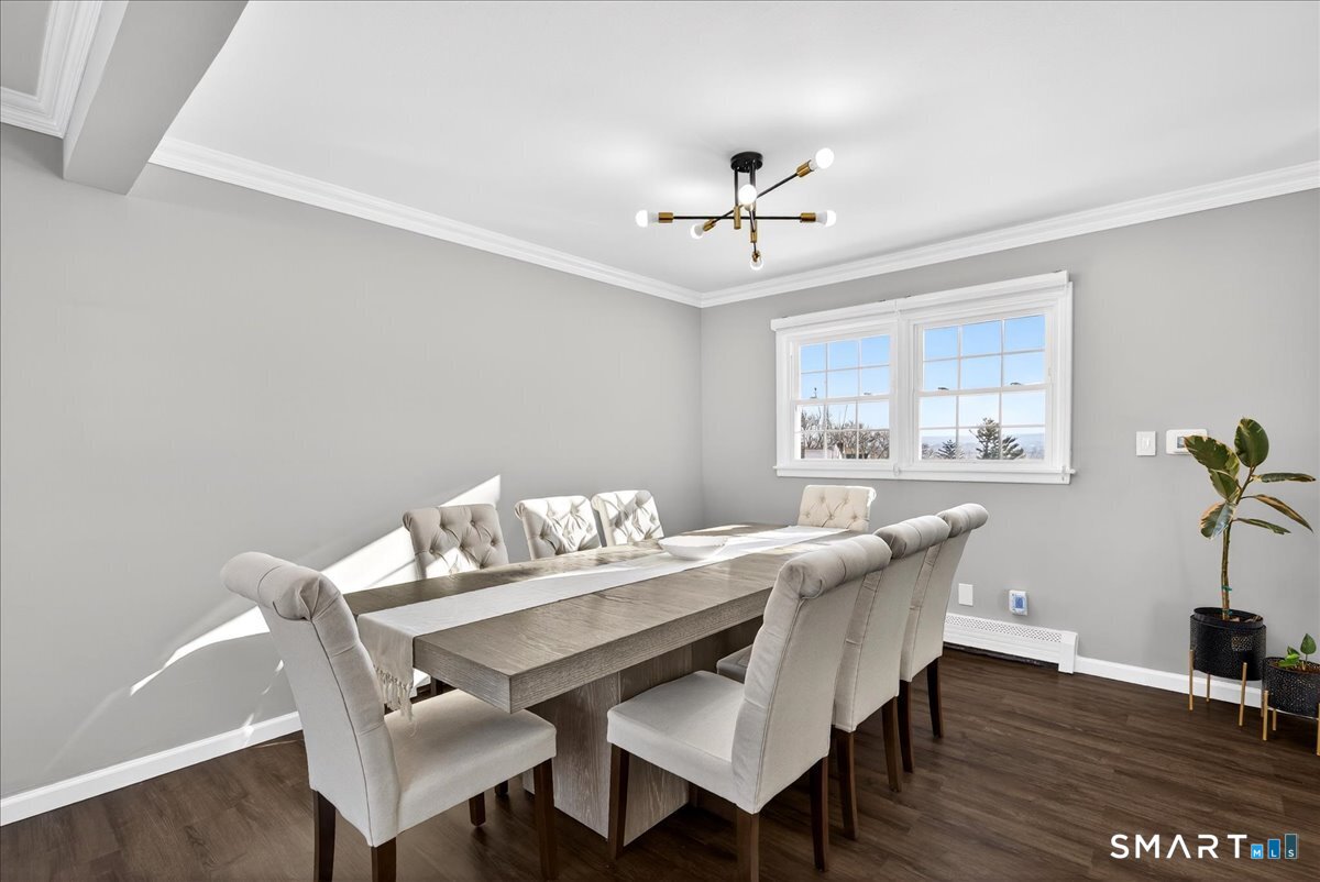114 Daniel Road Hamden, CT 06517 - Photo 4 of 32 a view of a dining room with furniture window and wooden floor