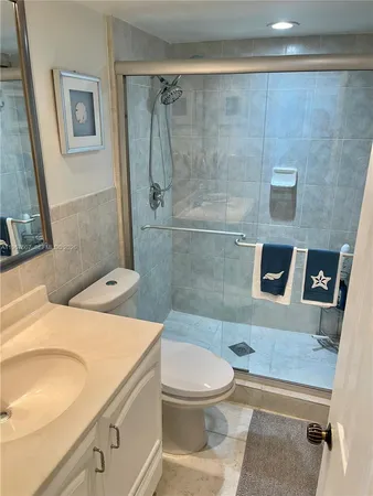 a view of a livingroom with wooden floor and furniture