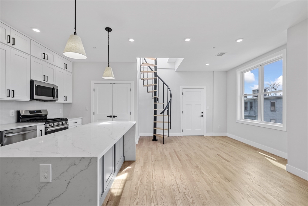 a kitchen with cabinets a sink and a stove