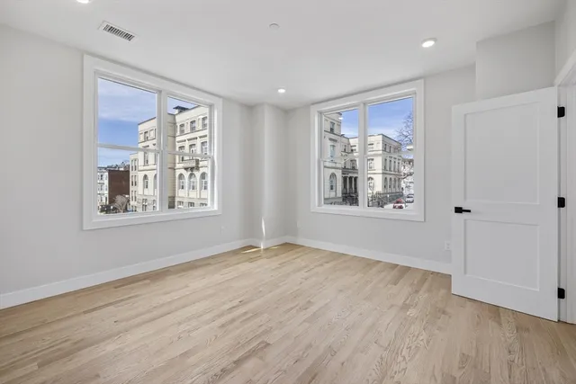 a bathroom with a toilet sink and a mirror
