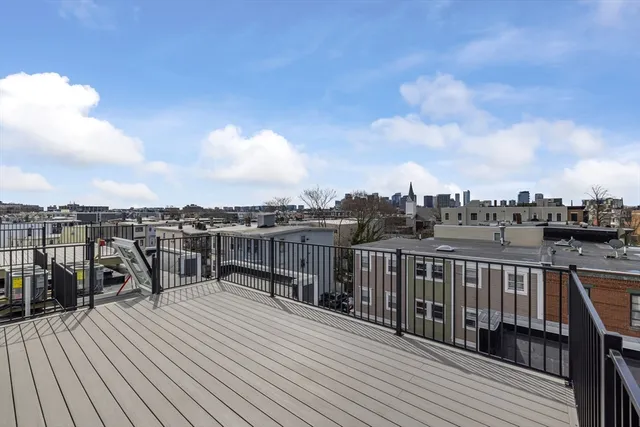 a view of a roof deck with couches