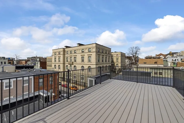 a view of a balcony with city view