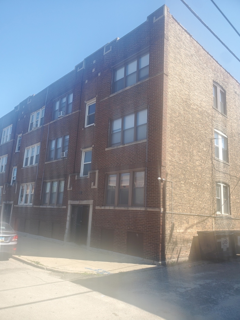 711 West 74th Street, Unit 1 Chicago, IL 60621 - Photo 1 of 9 a view of a building from a window