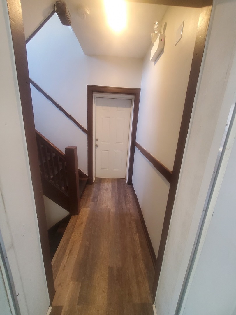 711 West 74th Street, Unit 1 Chicago, IL 60621 - Photo 3 of 9 a view of hallway with stairs