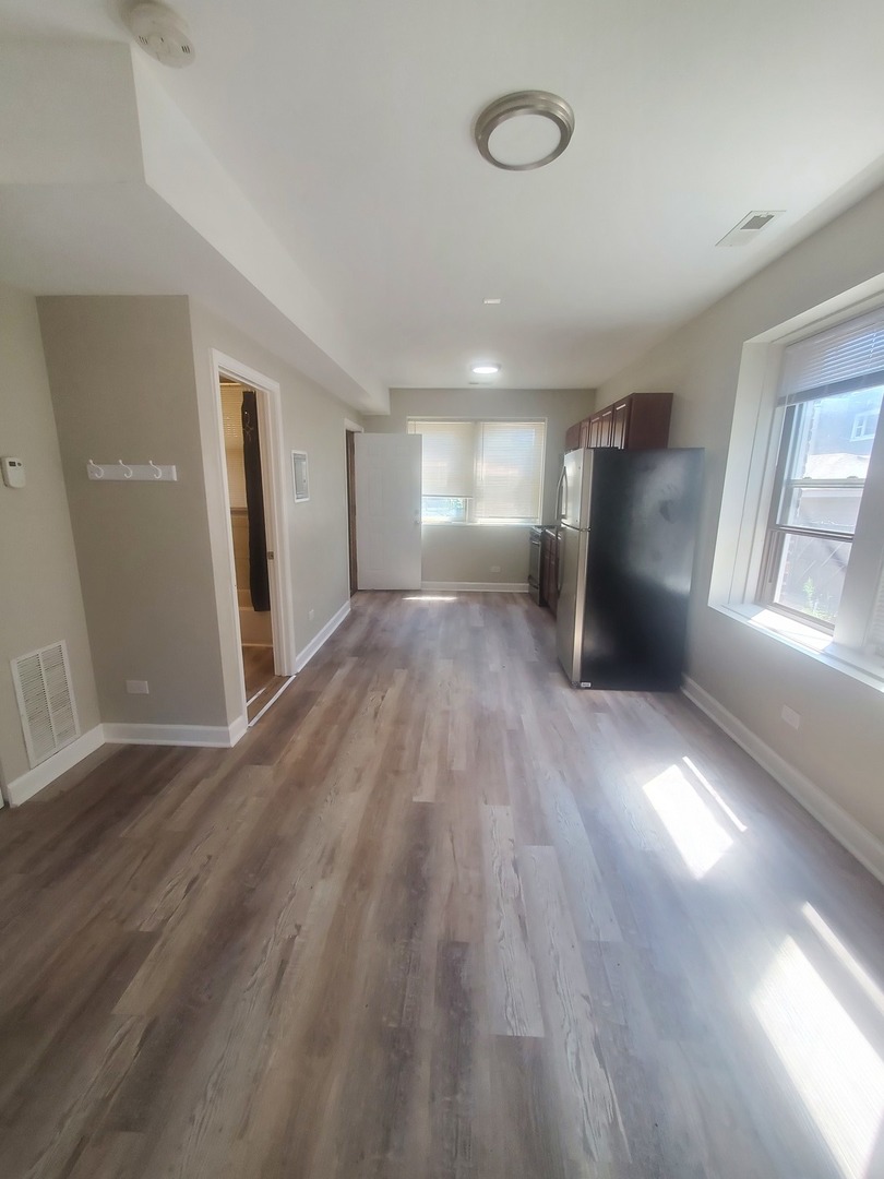 711 West 74th Street, Unit 1 Chicago, IL 60621 - Photo 4 of 9 a view of entryway with wooden floor