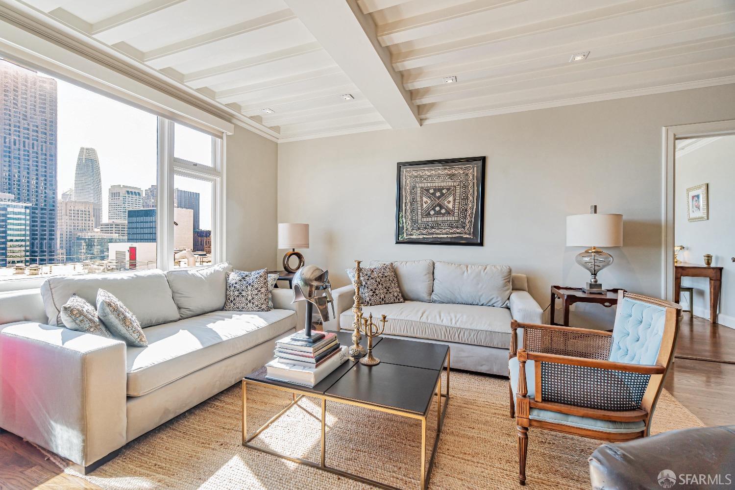 850 Powell Street, Unit 603 San Francisco, CA 94108 - Photo 12 of 47 a living room with furniture and a large window