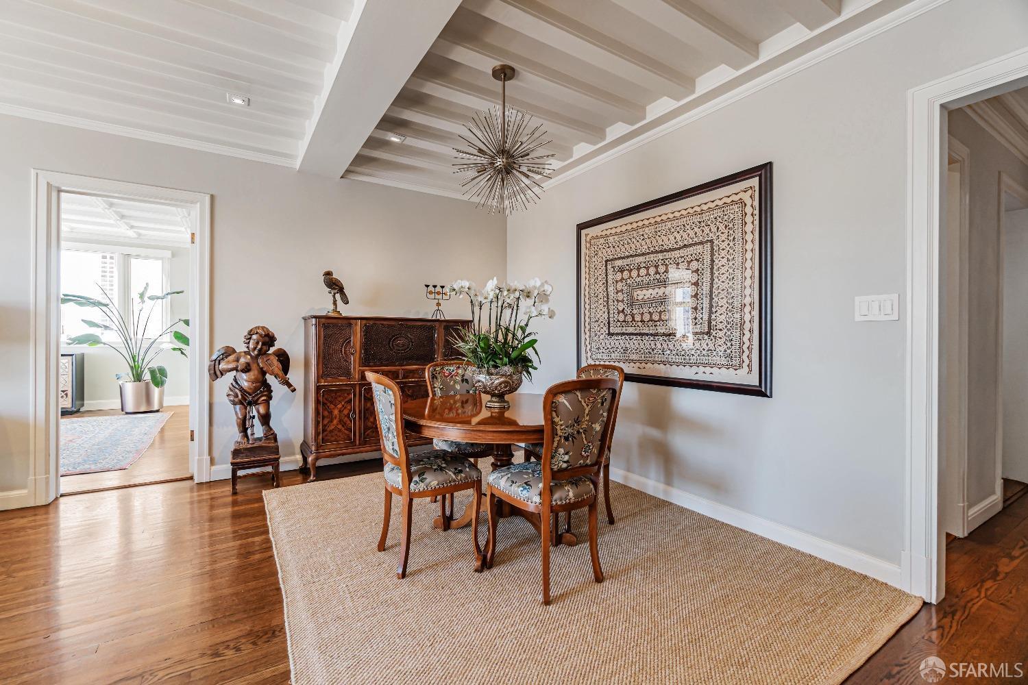 850 Powell Street, Unit 603 San Francisco, CA 94108 - Photo 22 of 47 a dining room with furniture window and wooden floor