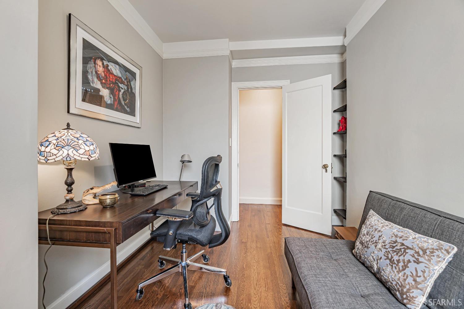 850 Powell Street, Unit 603 San Francisco, CA 94108 - Photo 27 of 47 a view of a workspace with furniture and wooden floor