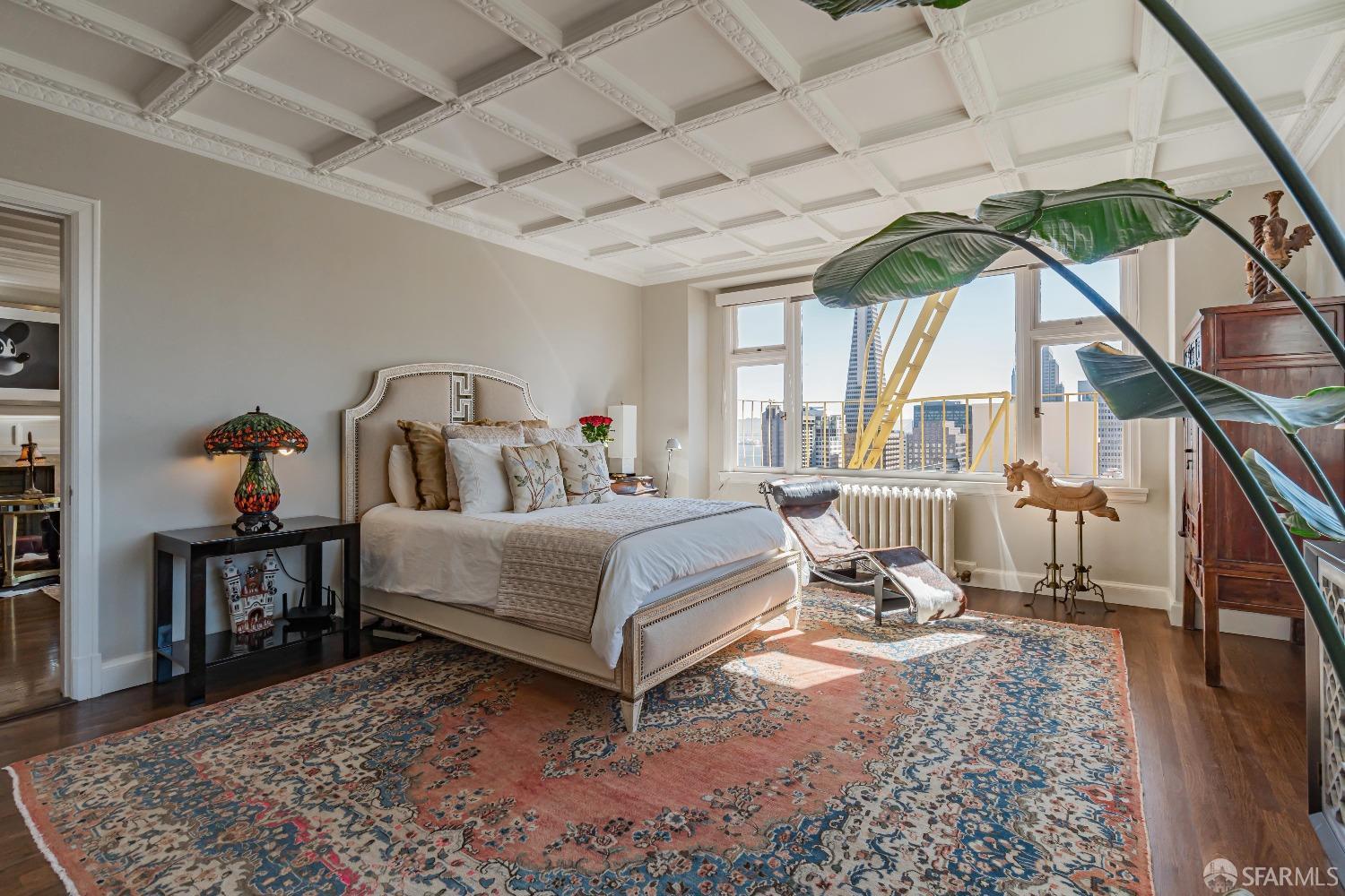 850 Powell Street, Unit 603 San Francisco, CA 94108 - Photo 29 of 47 a bedroom with a bed a table and chair