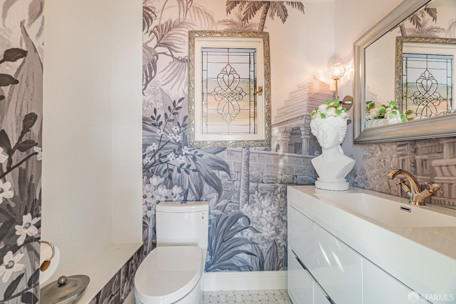 850 Powell Street, Unit 603 San Francisco, CA 94108 - Photo 33 of 47 a bathroom with a toilet sink and mirror