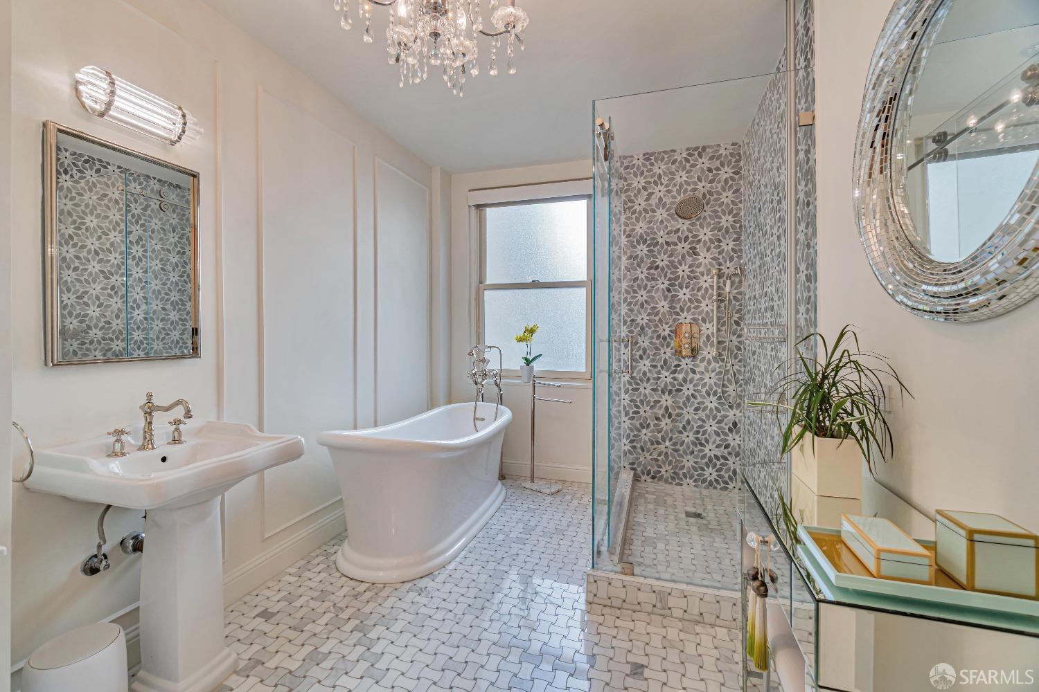 850 Powell Street, Unit 603 San Francisco, CA 94108 - Photo 35 of 47 a bathroom with a toilet a sink and mirror