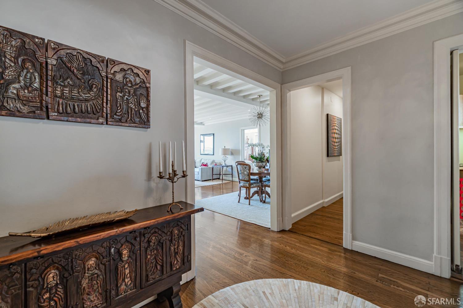 850 Powell Street, Unit 603 San Francisco, CA 94108 - Photo 6 of 47 a view of a hallway with wooden floor and dining room