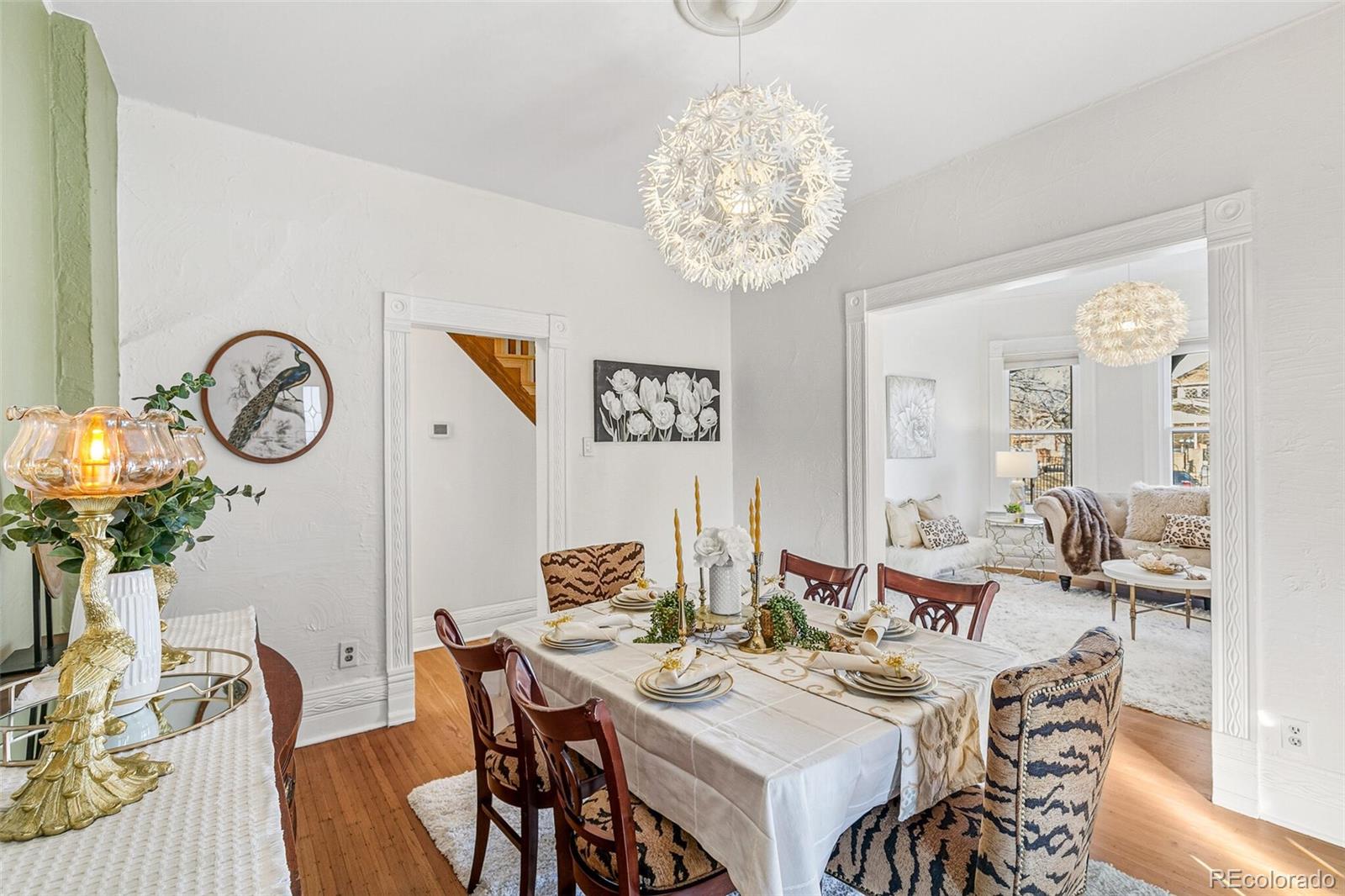 3885 Wolff Street Denver, CO 80212 - Photo 6 of 50 a view of a dining room with furniture wooden floor and chandelier