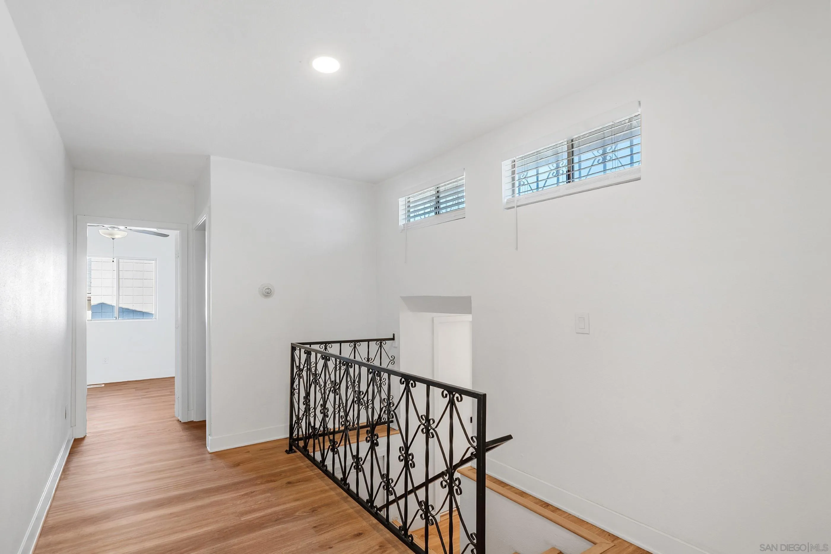 628 Paraiso Avenue Spring Valley, CA 91977 - Photo 18 of 38 a view of a hallway with wooden floor and stairs