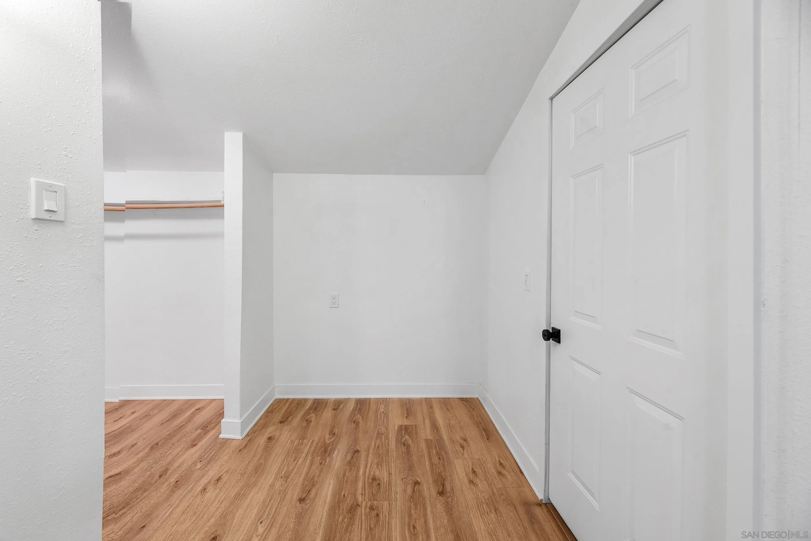 628 Paraiso Avenue Spring Valley, CA 91977 - Photo 22 of 38 a view of a room with wooden floor and a ceiling fan