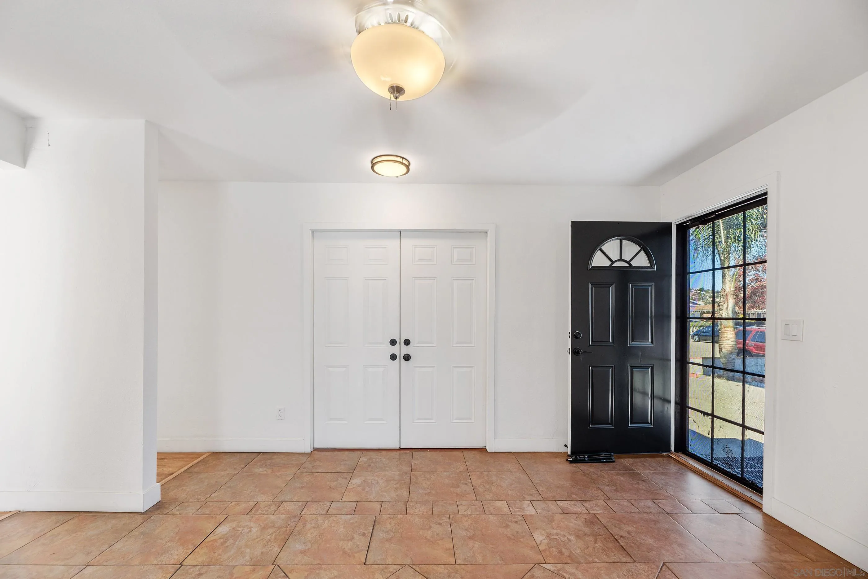 628 Paraiso Avenue Spring Valley, CA 91977 - Photo 4 of 38 an empty room with windows and closet