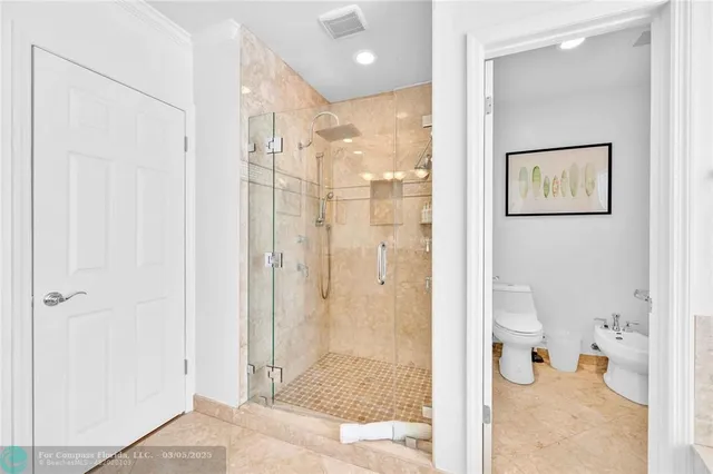 a bathroom with a shower and toilet
