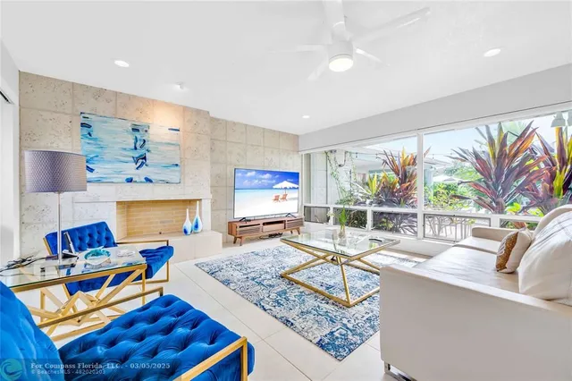 a living room with furniture and a rug