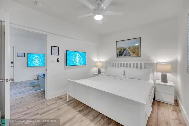 a bedroom with a bed and a desk