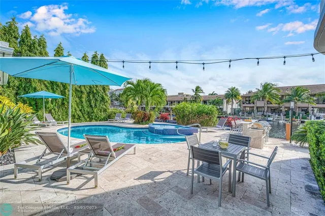a view of a patio with furniture and a potted plants