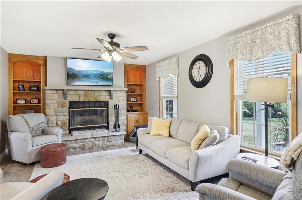 174 Hollow Road Darlington, PA 16115 - Photo 13 of 50 a living room with furniture a fireplace and a flat screen tv