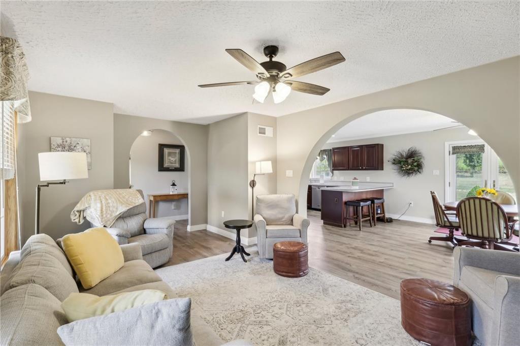 174 Hollow Road Darlington, PA 16115 - Photo 14 of 50 a living room with furniture a fireplace and a flat screen tv