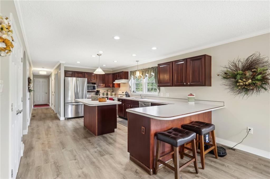 174 Hollow Road Darlington, PA 16115 - Photo 16 of 50 a kitchen with a sink a counter top space and stainless steel appliances
