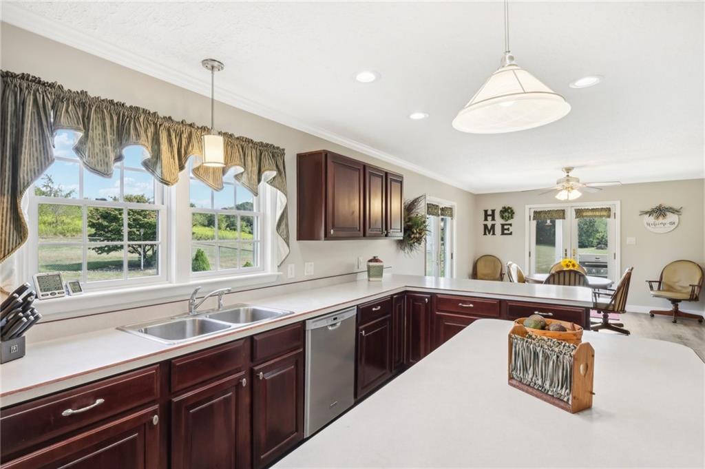 174 Hollow Road Darlington, PA 16115 - Photo 19 of 50 a kitchen with granite countertop a sink and a stove