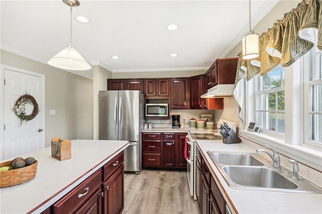 174 Hollow Road Darlington, PA 16115 - Photo 20 of 50 a kitchen with stainless steel appliances granite countertop a sink a stove and a refrigerator
