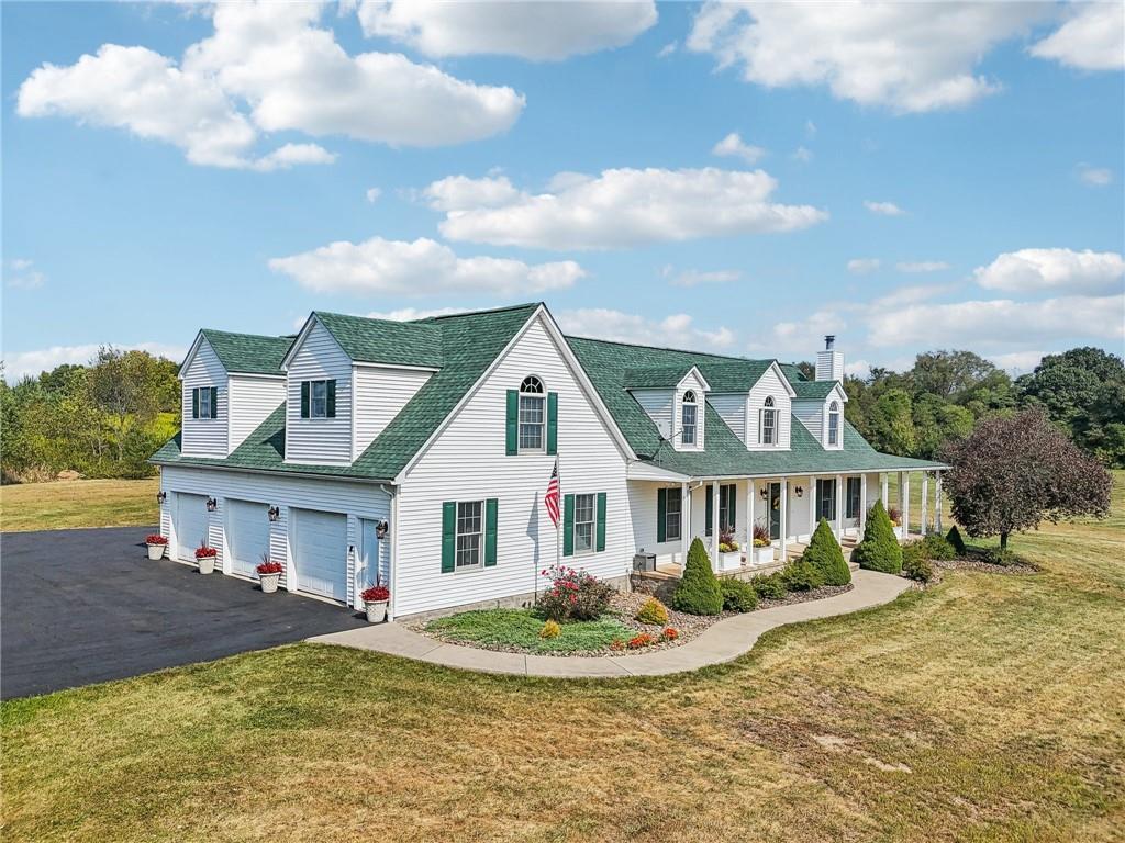174 Hollow Road Darlington, PA 16115 - Photo 2 of 50 a view of a white house with a big yard and potted plants