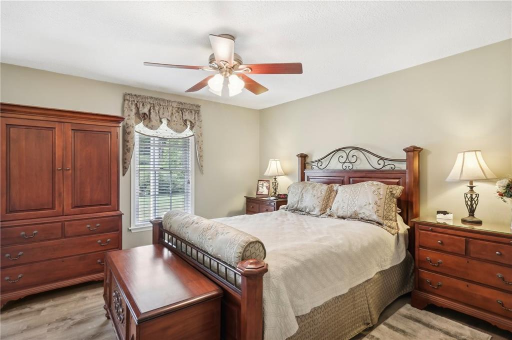 174 Hollow Road Darlington, PA 16115 - Photo 22 of 50 a bedroom with a bed and wooden floor