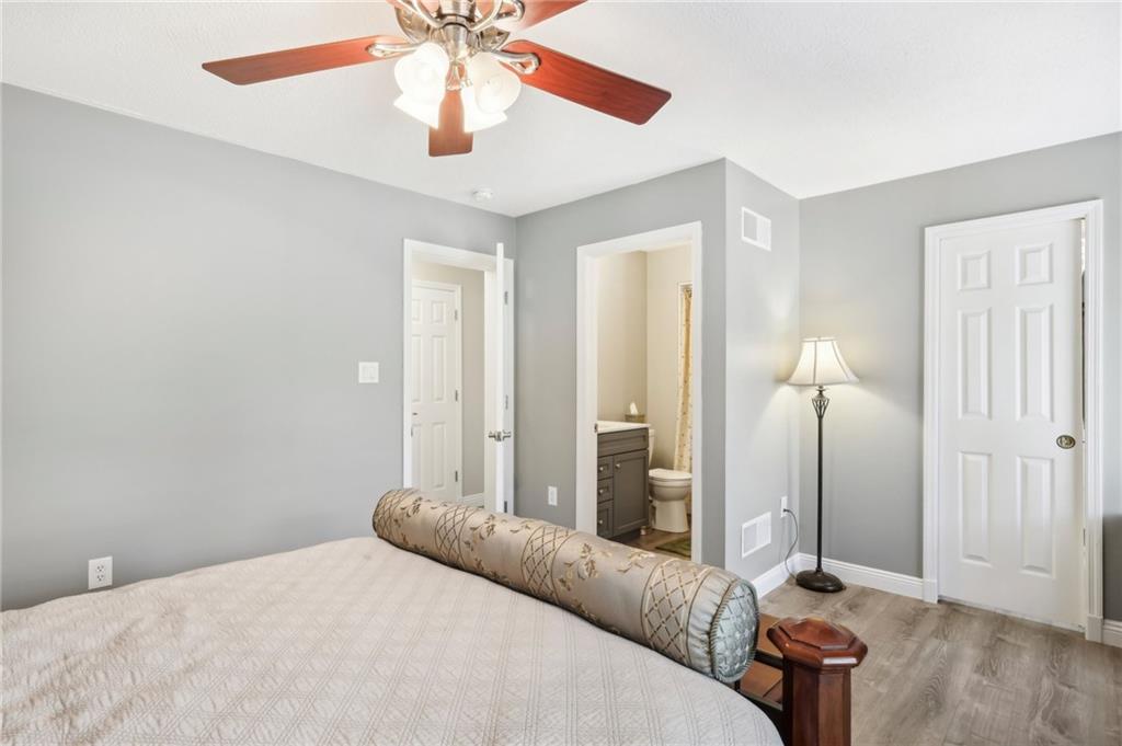 174 Hollow Road Darlington, PA 16115 - Photo 24 of 50 a bedroom with a bed and a chandelier