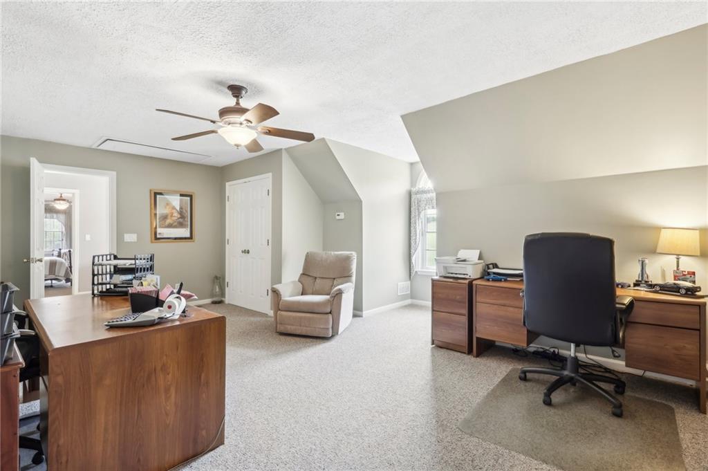 174 Hollow Road Darlington, PA 16115 - Photo 32 of 50 a view of a livingroom with workspace and a couch