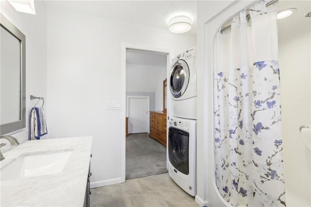 174 Hollow Road Darlington, PA 16115 - Photo 38 of 50 a bathroom with a sink and a washer dryer