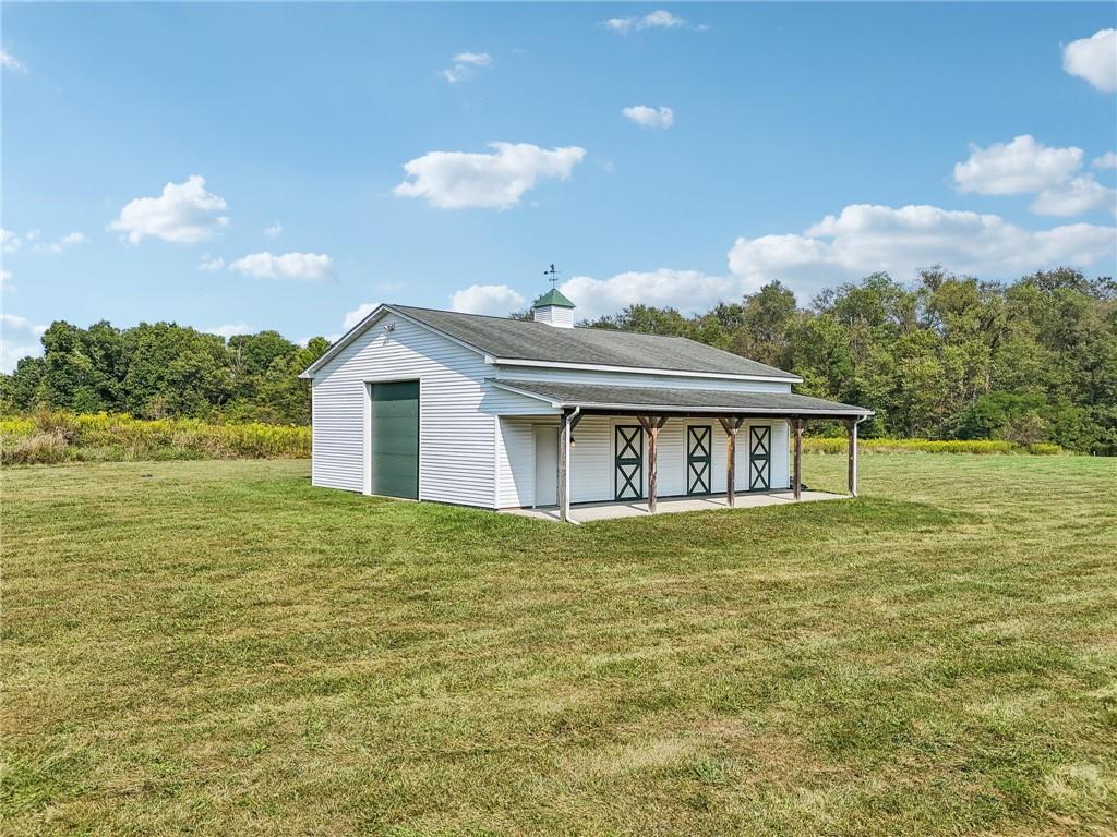 174 Hollow Road Darlington, PA 16115 - Photo 6 of 50 a house view with a garden space