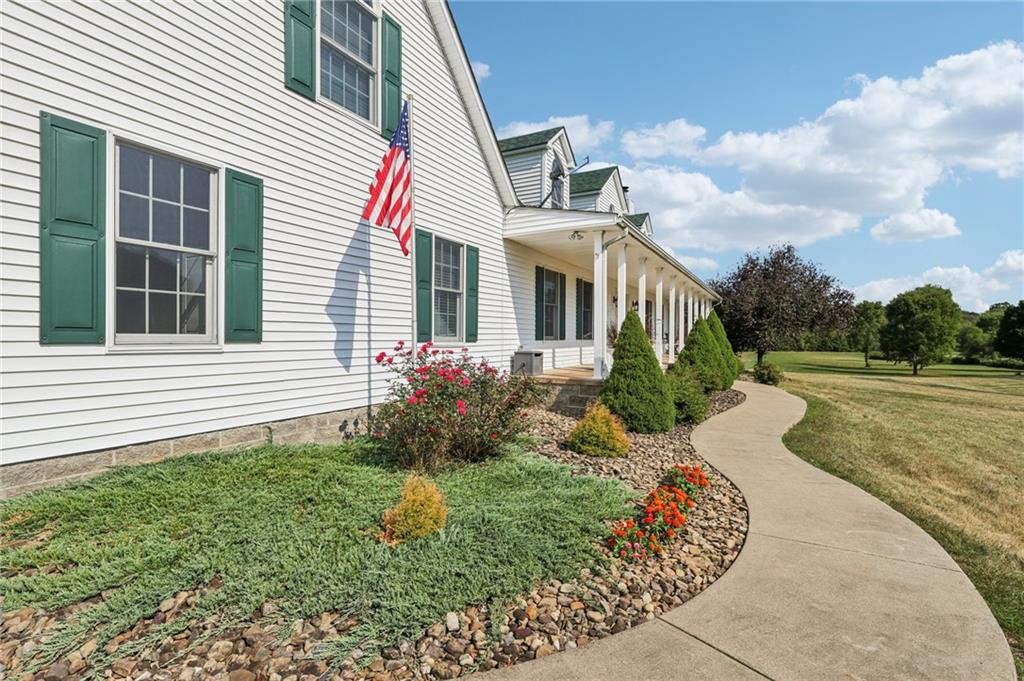 174 Hollow Road Darlington, PA 16115 - Photo 9 of 50 a front view of a house with garden