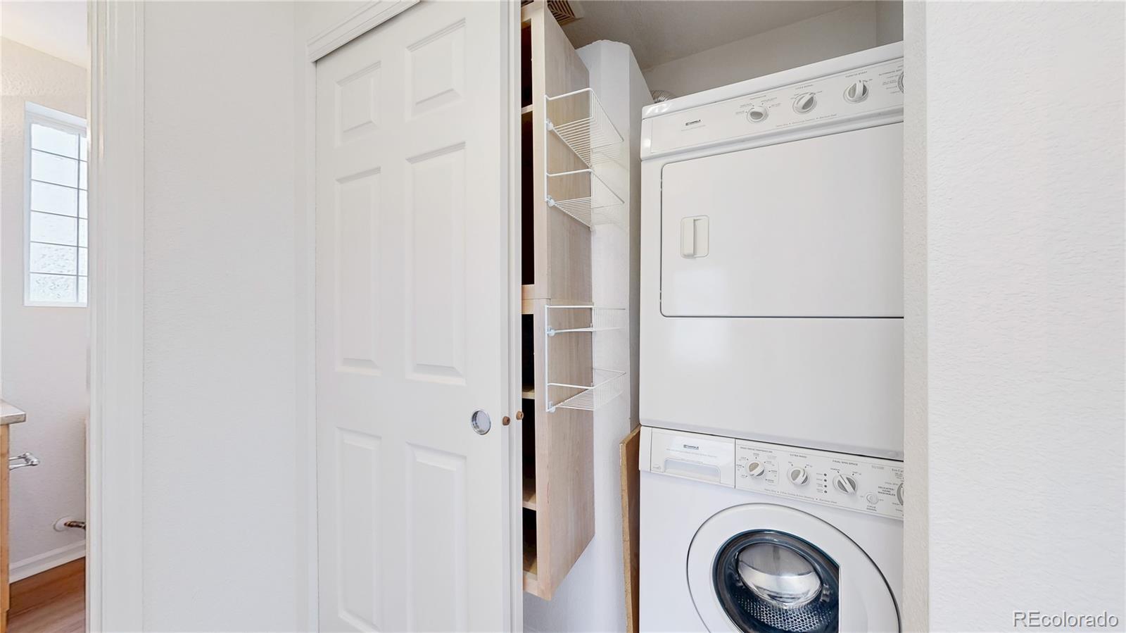 11738 Zenobia Loop Westminster, CO 80031 - Photo 24 of 34 a utility room with dryer and washer