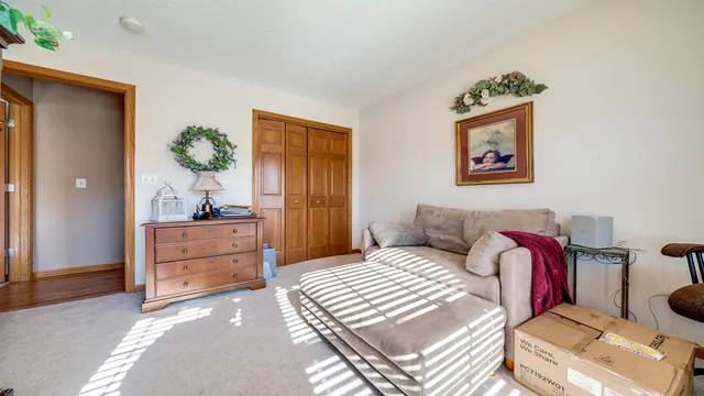 a bedroom with a bed and a dresser