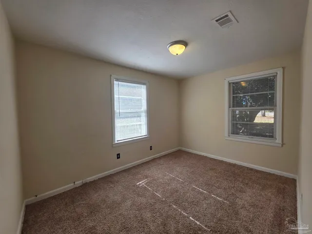 a view of an empty room and window