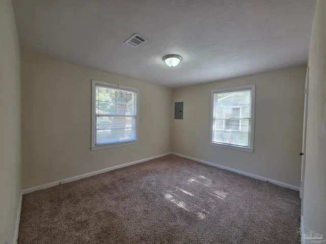 an empty room with windows